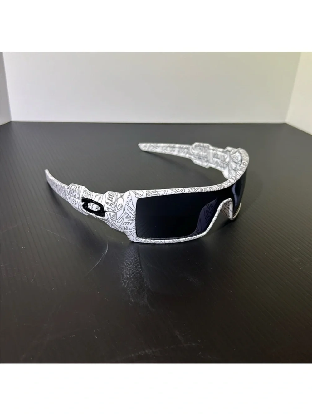 Oakley White Graphic Wrap Sunglasses with Black Lenses